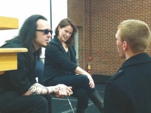 Damien Echols along with his douche goggles and douche beard with their lovely wife, The Joker.